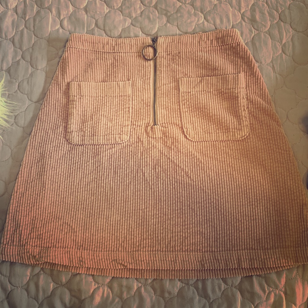 Pink corduroy mini skirt with pockets